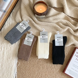 Men's wool blend crew socks in neutral colors with classic vertical ribbed knit texture