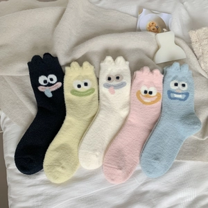 Five pairs of fluffy camel wool socks with cute cartoon eyes and various soft colors