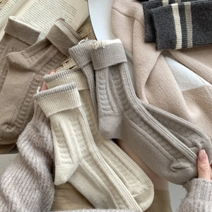 Thick wool blend mid-calf socks for women featuring warm ribbed knit and soft texture