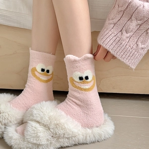 Cute pink camel wool socks with cartoon face and warm knit texture for winter