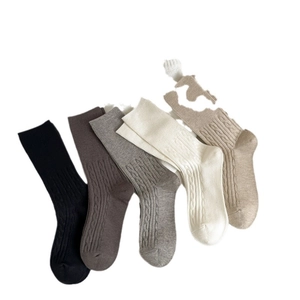 Five pack of women's cable knit crew socks in neutral autumn colors on white background