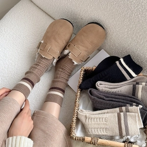 Women's warm wool striped crew socks shown with brown suede mules and cozy knit textures