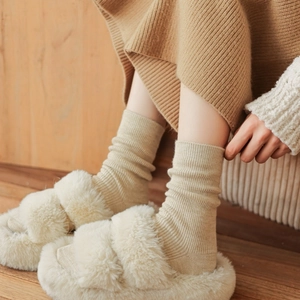 Beige thick knitted socks and matching plush slippers set for autumn and winter comfort