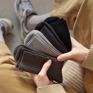 Close-up of thick ribbed cashmere-like socks in assorted neutral autumn colors