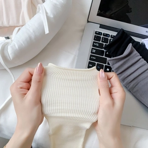 Macro shot showing high elasticity and ribbed knit texture of soft cotton socks