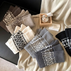 Fair Isle pattern knitted leg warmers in various colors for cozy winter styling