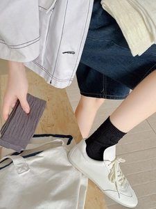 Detail showing knit texture and ribbed cuffs of breathable vertical cable cotton socks