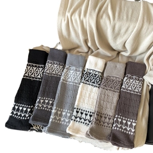 Fair Isle knitted leg warmers in six neutral colors with floral patterns for winter boots