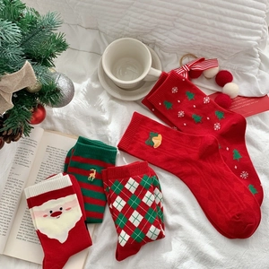 Cozy Christmas themed mid-calf cotton socks set with festive holiday patterns in red and green