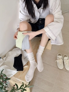 Detail of lightweight ribbed cotton mesh socks in various colors with breathable design