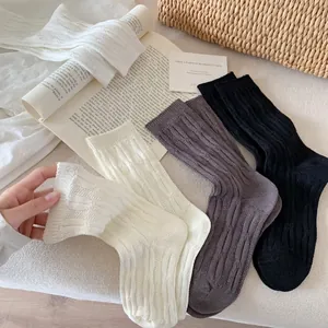 Breathable vertical cable knit crew socks in white, grey, and black set for women