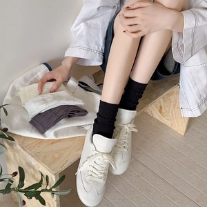 Breathable cable knit mid-calf cotton socks in black, white, and beige colors for women
