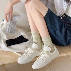 Women's lightweight mesh crew socks with vertical knit design in green and neutral colors