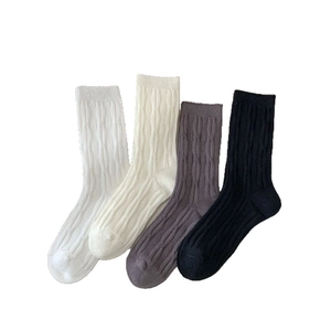 4-pack of cable-knit crew socks in white, beige, grey, and black colors for women