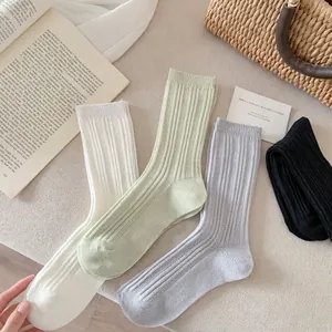 Lightweight breathable cotton crew socks in neutral colors with ribbed knit texture