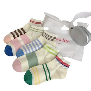 Five pack of colorful striped cotton socks for women in various vibrant dopamine styles