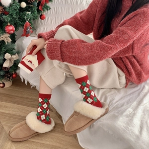 Cozy Christmas gift set featuring red plaid socks and warm suede slippers with fur lining