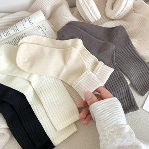 Women's 4-pack ribbed crew socks in white, black, beige, and grey premium combed cotton