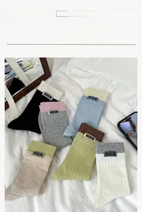 Detailed view of ribbed cotton crew socks featuring Amity fabric label in diverse colors