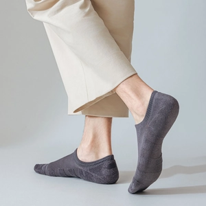 Detail of dark grey invisible sock with thickened terry sole and ribbed cuff design