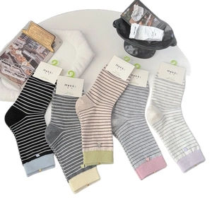 Five pack striped cotton crew socks for women in assorted retro colors with card tags