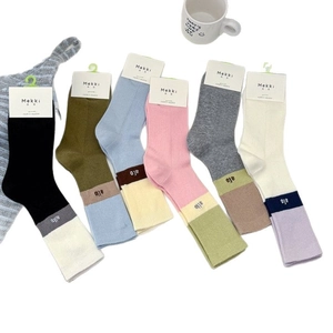 Set of six colorful ribbed knit mid-calf socks with letter embroidery and packaging