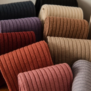 Soft ribbed knit crew socks in various warm earth tones and Morandi colors