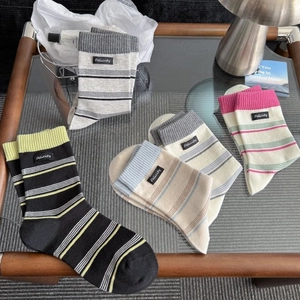 Women's casual striped combed cotton crew socks in multiple colors with ribbed cuffs