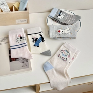 Five pack of cartoon dog pattern cotton crew socks in grey, white, and pink for women