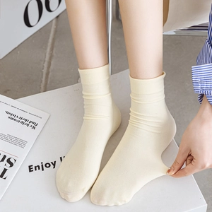 Elastic light yellow cotton calf socks for women with a comfortable velvet texture