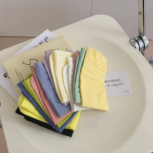 Colorful combed cotton mid-calf socks set in pastel shades with ribbed knit texture