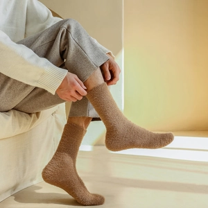 Close-up of thick khaki mink velvet socks featuring a fluffy texture and elastic cuffs