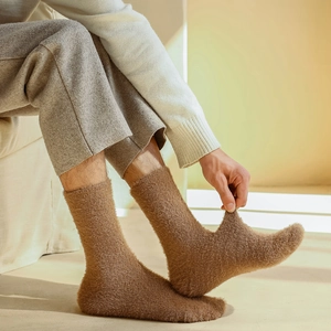Detailed texture of thick brown fleece socks with soft elastic material for winter