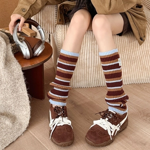 Japanese style colorful striped knit leg warmers in brown and blue with ribbed cuffs