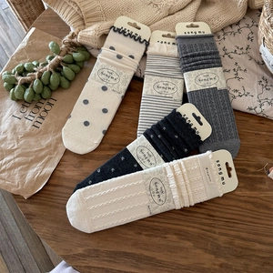Detailed set of five patterned wool blend socks with dots and stripes in gift packaging