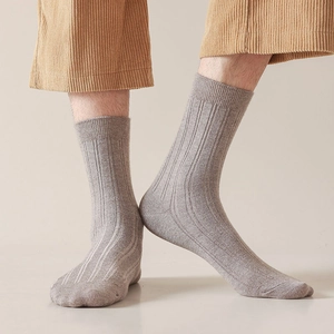 Men's ribbed crew socks in oatmeal grey, styled with corduroy pants for a casual look
