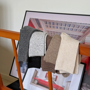 Thick wool socks in five neutral colors with vertical knit texture for winter warmth