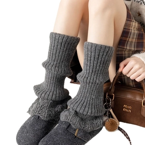 Deep grey chunky knit leg warmers with layered slouchy design and wool-like texture