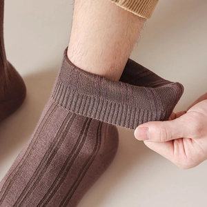 Close-up of brown cotton ribbed sock showing high elasticity and soft knit texture