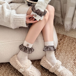 Retro knit crew socks with brown plaid ruffle trim and decorative button detail