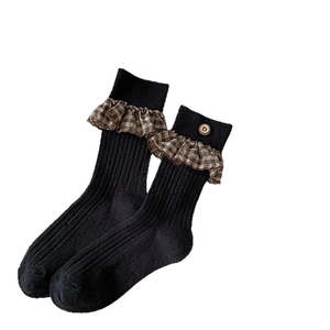 Vintage black ribbed mid-calf socks with plaid lace trim and button detail