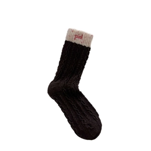 Thick dark brown cable knit wool socks with creamy rib cuffs and pink embroidery