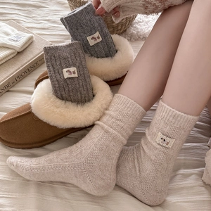 Cozy winter thick wool socks with cute animal patch and vintage cable knit texture