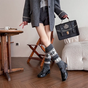 Detailed knit leg warmers with vintage snowflake jacquard patterns and ribbed cuffs