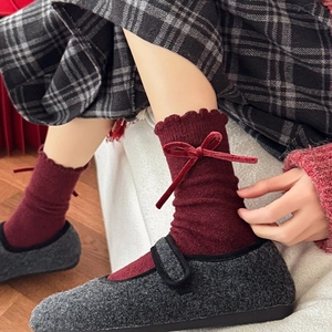 Cozy wool blend socks with red velvet bow paired with vintage Mary Jane shoes
