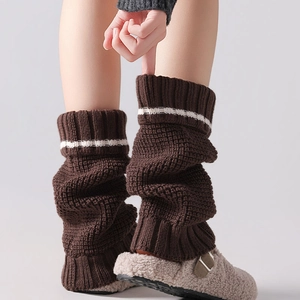 Knitted leg warmers for women in dark brown with white stripes for a warm JK style look