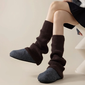 Deep brown knitted leg warmers for women in stylish vertical ribbed pattern socks