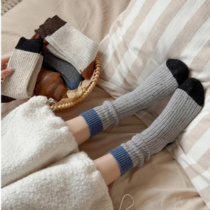 Close-up of thick ribbed knit wool socks with contrasting toe and heel detail