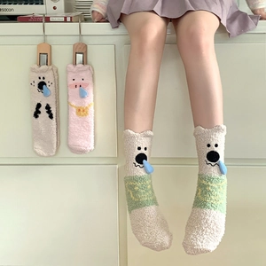 Detail of coral fleece thick socks with cute 3D cartoon animal snout and warm texture