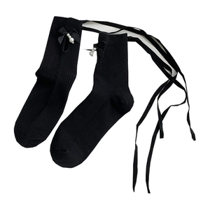 Japanese Lolita style black knit calf socks with lace-up ribbons and pearl bows